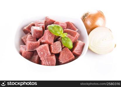 Diced beef with onion over white background