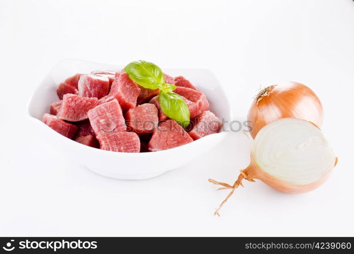 Diced beef with onion over white background