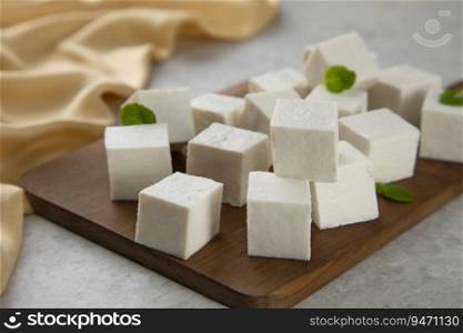 Diced Paneer or cottage cheese with green leaves. 