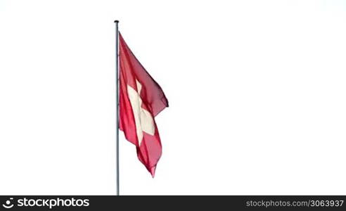 Die Flagge der Schweiz weht im Wind. Flag of Switzerland waving in the wind.