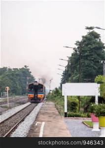 Diesel multiple unit of the rapid train is leaving from the local station to the city area in the northern of Thailand.