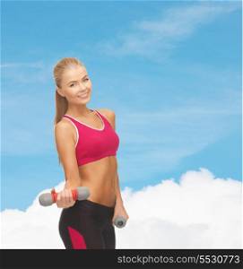 diet and fitness concept - young sporty woman with light dumbbells