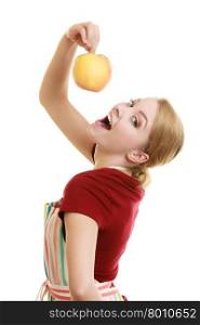 Diet and nutrition. Happy housewife or chef in striped kitchen apron offering red apple healthy fruit isolated