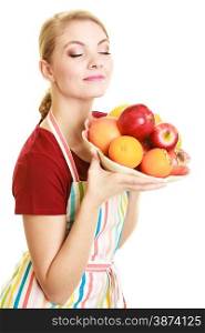 Diet and nutrition. Happy housewife or chef offering healthy fruit closed eyes smelling isolated