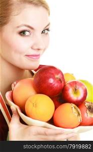 Diet and nutrition. Happy housewife or chef offering healthy fruit isolated
