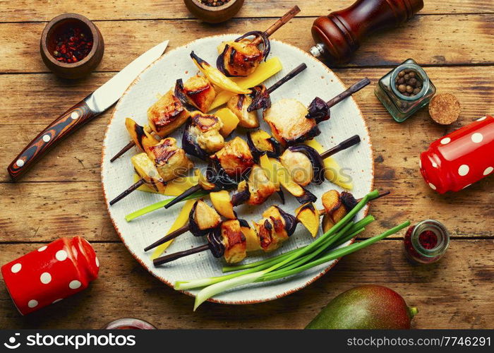 Diet chicken skewer with ripe mango. Shashlik. Delicious chicken kebabs, shashlik