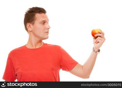 Diet concept health care healthy nutrition. Handsome man in red shirt holds apple, natural fruit vitamin isolated on white background