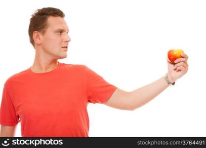 Diet concept health care healthy nutrition. Handsome man in red shirt holds apple, natural fruit vitamin isolated on white background