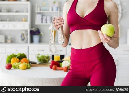 diet concept with sporty woman kitchen 2. Resolution and high quality beautiful photo. diet concept with sporty woman kitchen 2. High quality beautiful photo concept