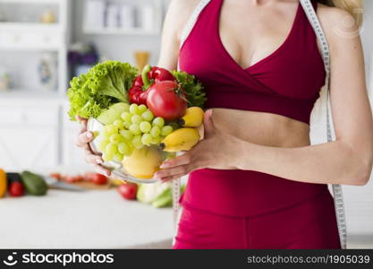 diet concept with sporty woman kitchen. Beautiful photo. diet concept with sporty woman kitchen