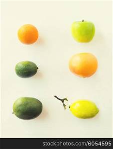 diet, eco food, healthy eating and objects concept - ripe fruits and vegetables over white