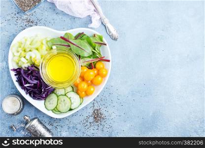 diet food, fresh vegetables and oil, ingredients for salad