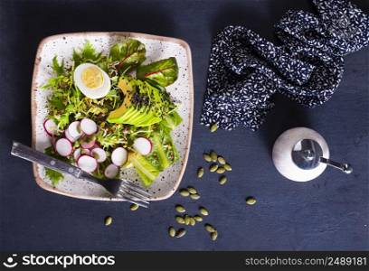 Diet food, helthy breakfast, salad with avocado and eggs. fresh salad, salad with avocado and boiled eggs