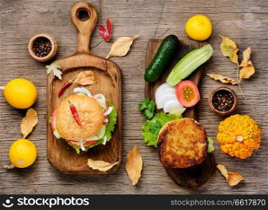 Diet hamburger with fresh vegetables and pumpkin cutlet.Appetizing squash burgers. Diet hamburger with vegetables