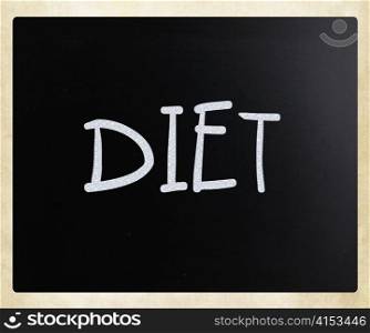 ""Diet" handwritten with white chalk on a blackboard"