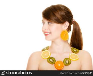 Diet. Happy girl with necklace and earrings of fresh citrus fruits isolated on white. Young woman recommending healthy food and nutrition.