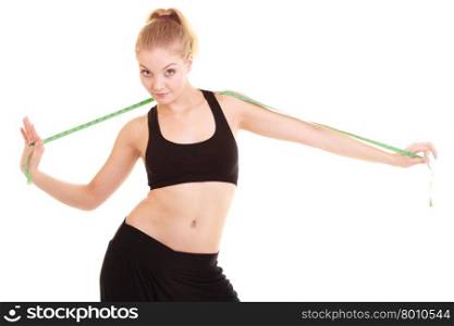 Diet, health care and healthy nutrition. Fitness young woman fit girl with green measure tape isolated on white.