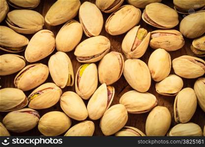 Diet healthcare concept. Food background. Roasted pistachio nuts seed with shell close up.