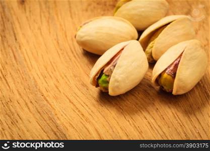 Diet healthcare concept. Roasted pistachio nuts seed with shell close up