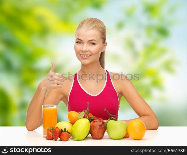 diet, healthy eating and people concept - woman with fruits and juice showing thumbs up over green natural background. woman with fruits and juice showing thumbs up. woman with fruits and juice showing thumbs up