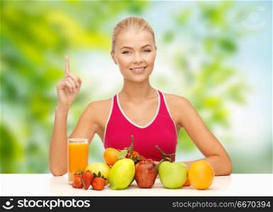 diet, healthy eating and people concept - woman with fruits and juice over green natural background. woman with fruits and juice over green background. woman with fruits and juice over green background