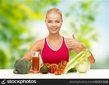 diet, healthy eating and people concept - woman with vegetable food and drink showing thumbs up over green natural background. woman with vegetables and juice showing thumbs up. woman with vegetables and juice showing thumbs up