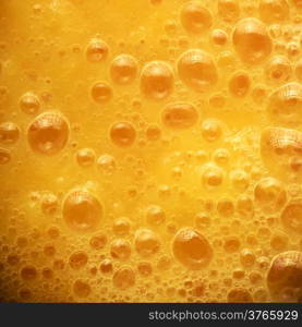 Diet healthy nutrition. Fresh yellow fruits juice background texture. Orange water bubbles. Macro Square format