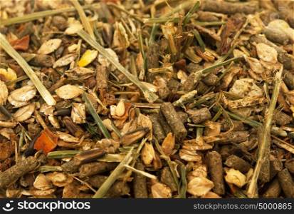 Diet muesli with herbs background for horse