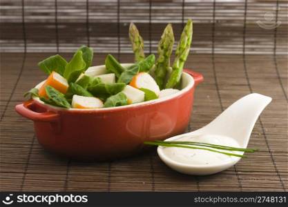diet salad. a diet salad with surimi, asparagus and tzatziki cream