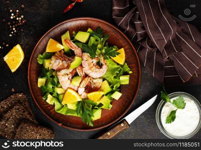 diet salad with avocado and boiled shrimps