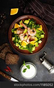 diet salad with avocado and boiled shrimps