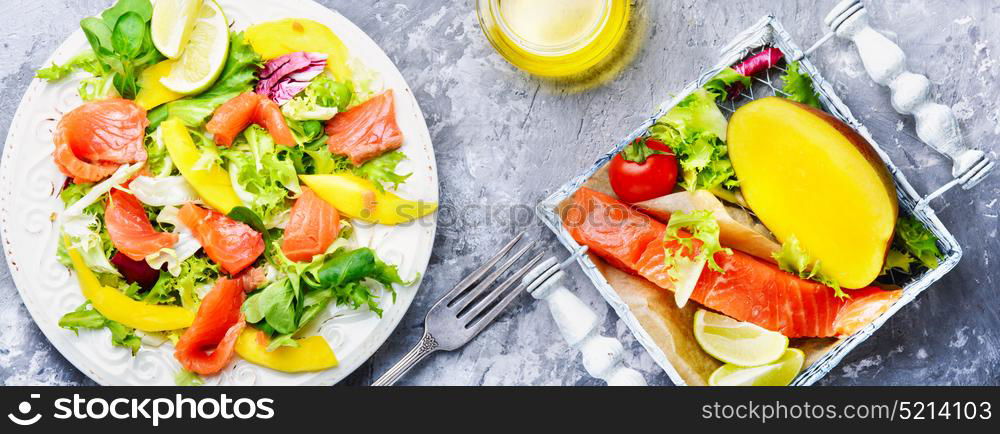 Diet salad with salmon,mango and fresh lettuce. lettuce salad with fish