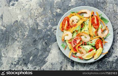 Diet salad with tomato, cucumber and shrimp.. Salad with prawn and vegetables