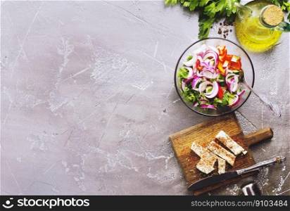 diet salad with vegetable and cheese, greek salad. greek salad in bowl, salad with vegetables and cheese on board