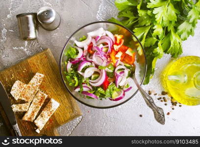 diet salad with vegetable and cheese, greek salad. greek salad in bowl, salad with vegetables and cheese on board