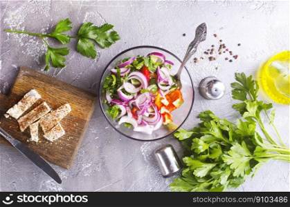diet salad with vegetable and cheese, greek salad. greek salad in bowl, salad with vegetables and cheese on board