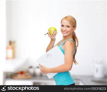 diet, sport and healthcare concept - beautiful sporty woman with scale and green apple