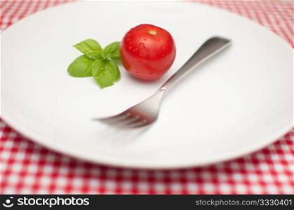 Diet - Tomato, Fresh Basil and Fork on Empty Plate