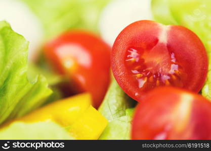 diet, vegetable food, healthy eating and objects concept - close up of ripe cut vegetables in salad