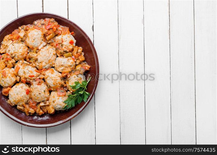 Dietary appetizing homemade meatballs with vegetable sauce.Flat lay with copy space. Meatballs in tomato sauce.