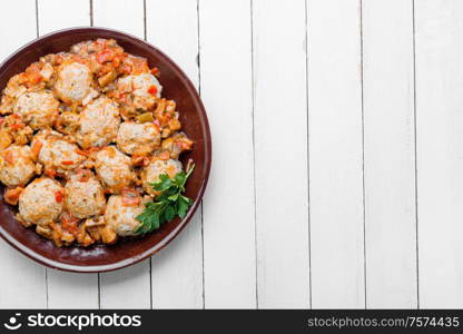 Dietary appetizing homemade meatballs with vegetable sauce.Flat lay with copy space. Meatballs in tomato sauce.