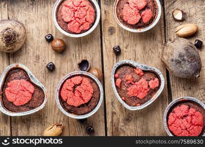 Dietary beetroot muffins with chocolate and nuts.Vegetarian food. Vegetarian beetroot muffins.