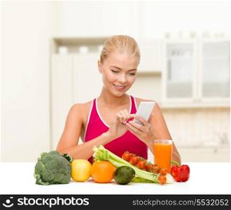 dieting, food, healthcare and technology concept - smiling sporty woman with fruits and vegetables counting calories in smartphone