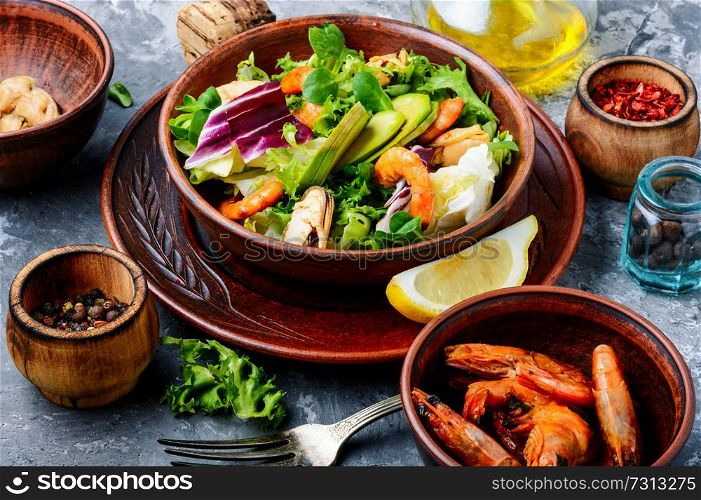 Dieting fresh seafood salad.Green salad with shrimps,mussel and avocado. Salad with prawns and mussels