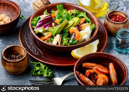 Dieting fresh seafood salad.Green salad with shrimps,mussel and avocado. Salad with prawns and mussels