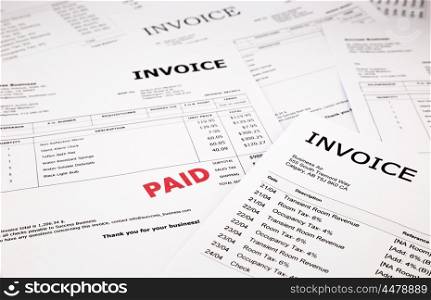 difference invoices and bills with red paid stamp, concept and ideas