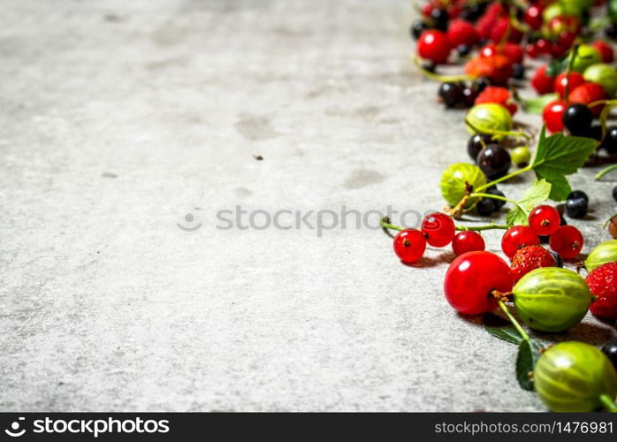 Different berries on the old stone table.. Different berries on the stone table.