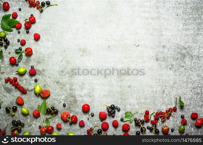 Different berries on the old stone table.. Different berries on the stone table.