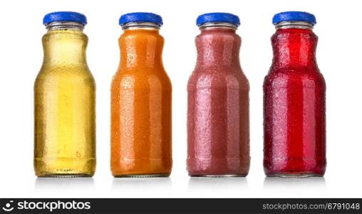 different bottles of juice on white background