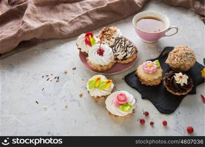 Different cakes composition. Different cakes composition on concrete background